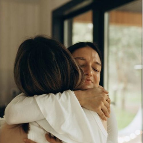 Parent and child sharing a hug